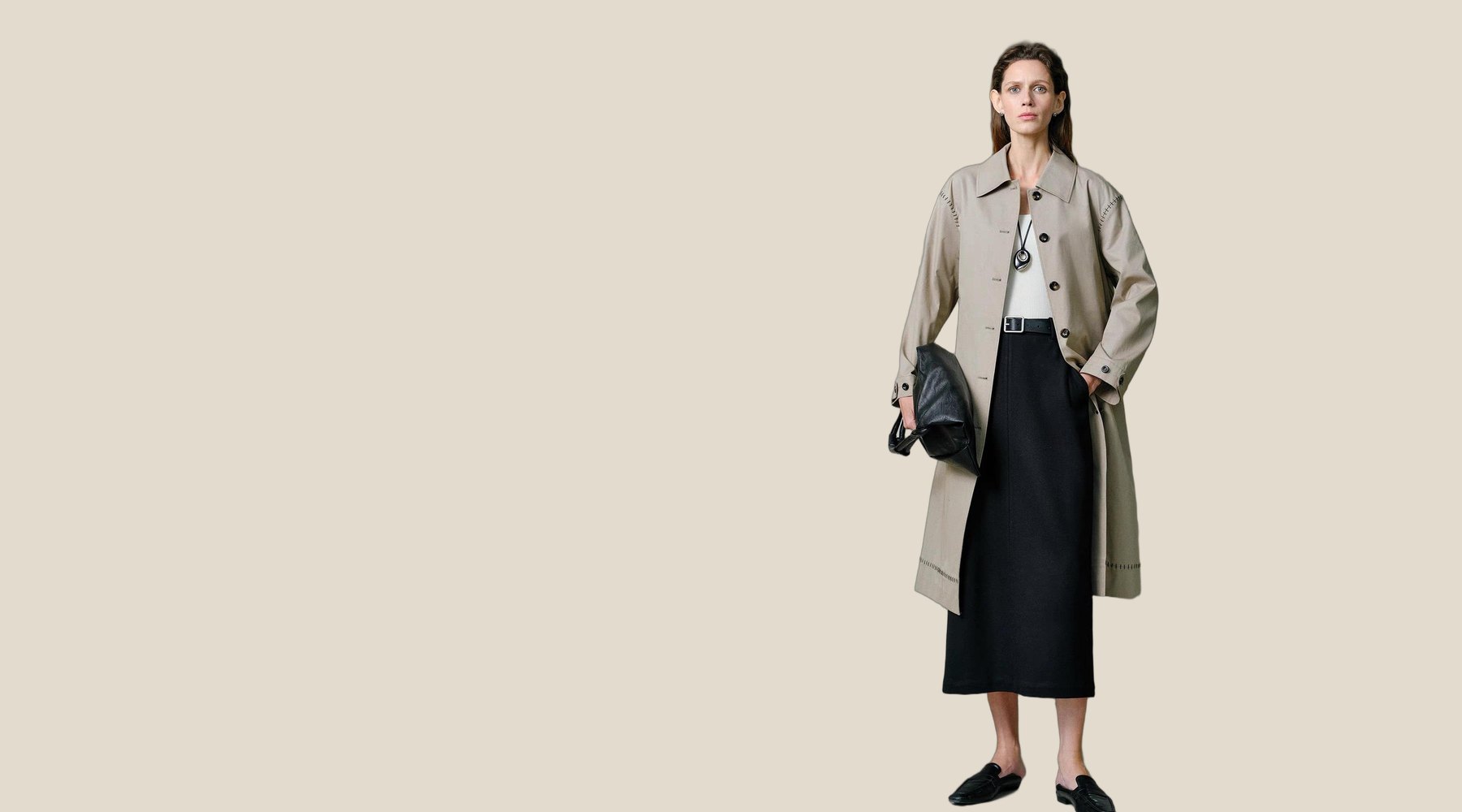 Model in a belted trench coat